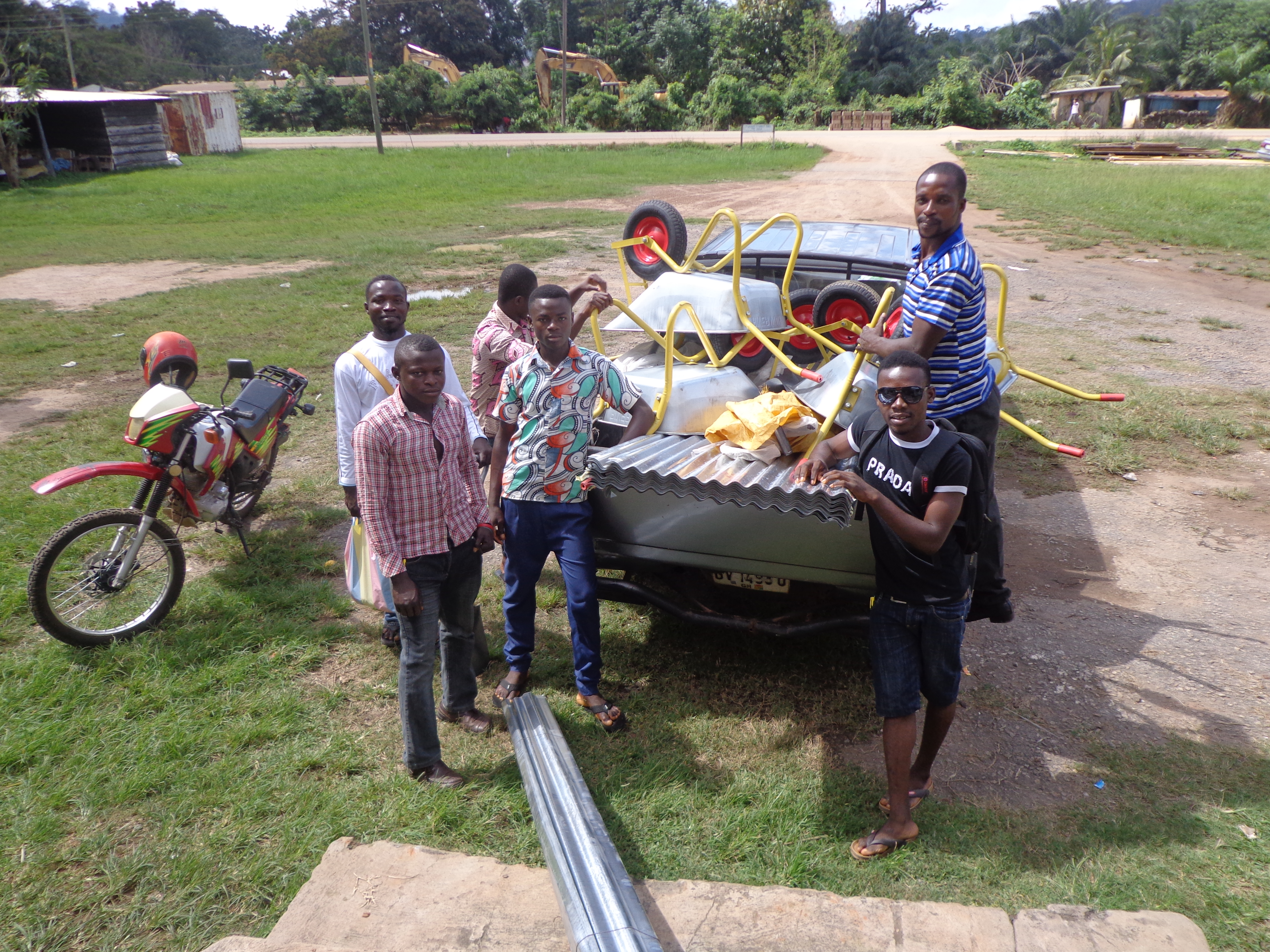 Group photo of community members gathered outdoors in Ghana